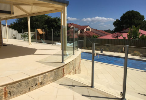 Curved semi-frameless glass pool fencing with custom panel