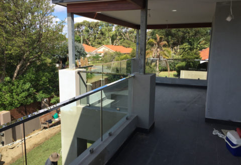 Semi-frameless glass balustrading with top fixed handrail